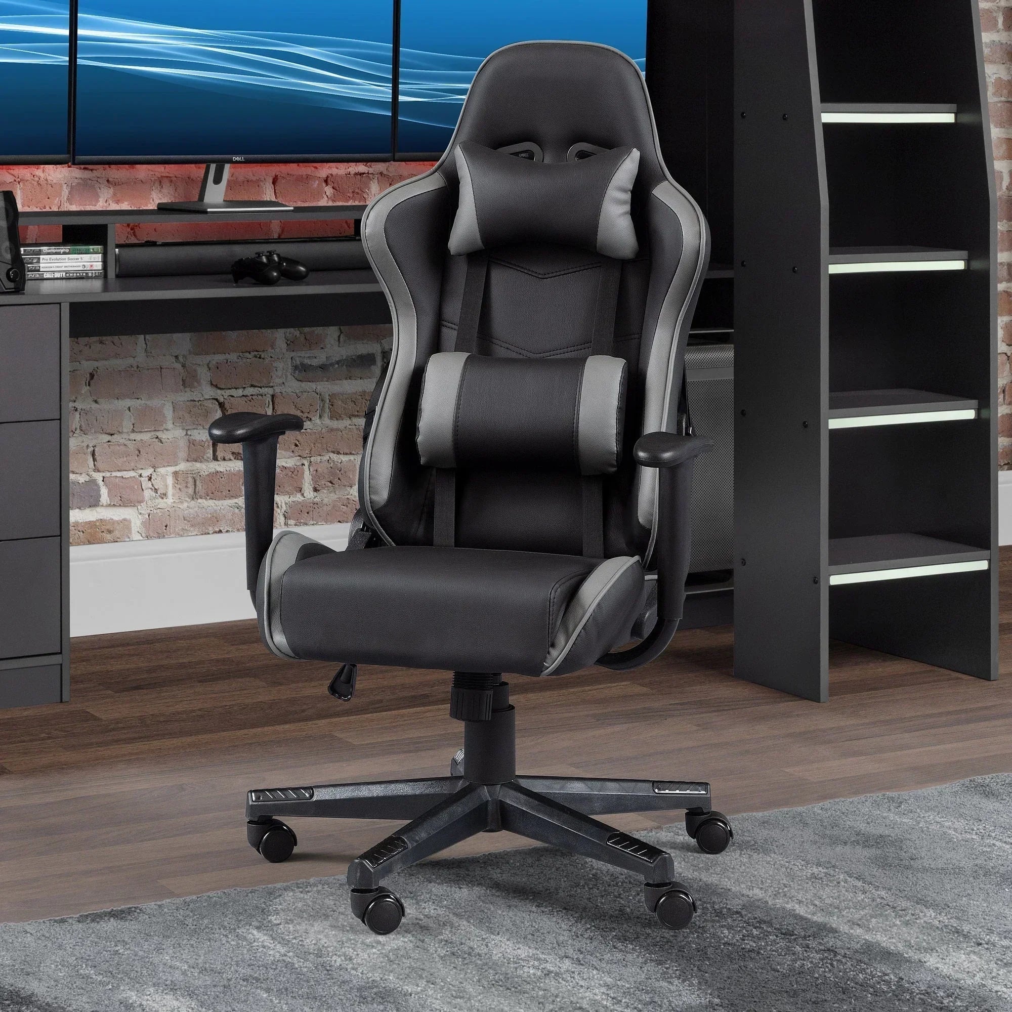 Black and grey gaming chair with headrest and lumbar support in modern home office setup