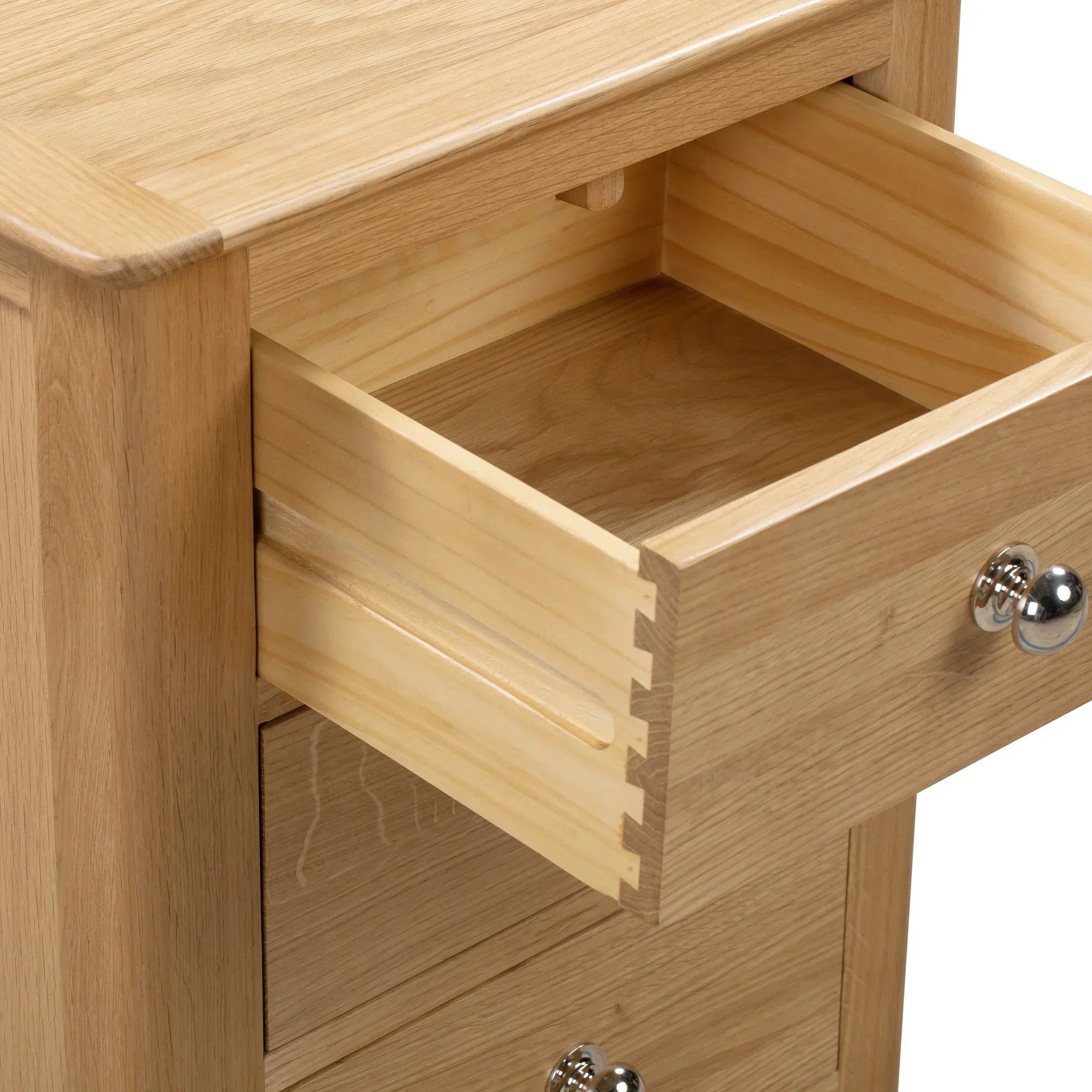 Cotswold three drawer bedside table close-up showing dovetail joints and silver handle