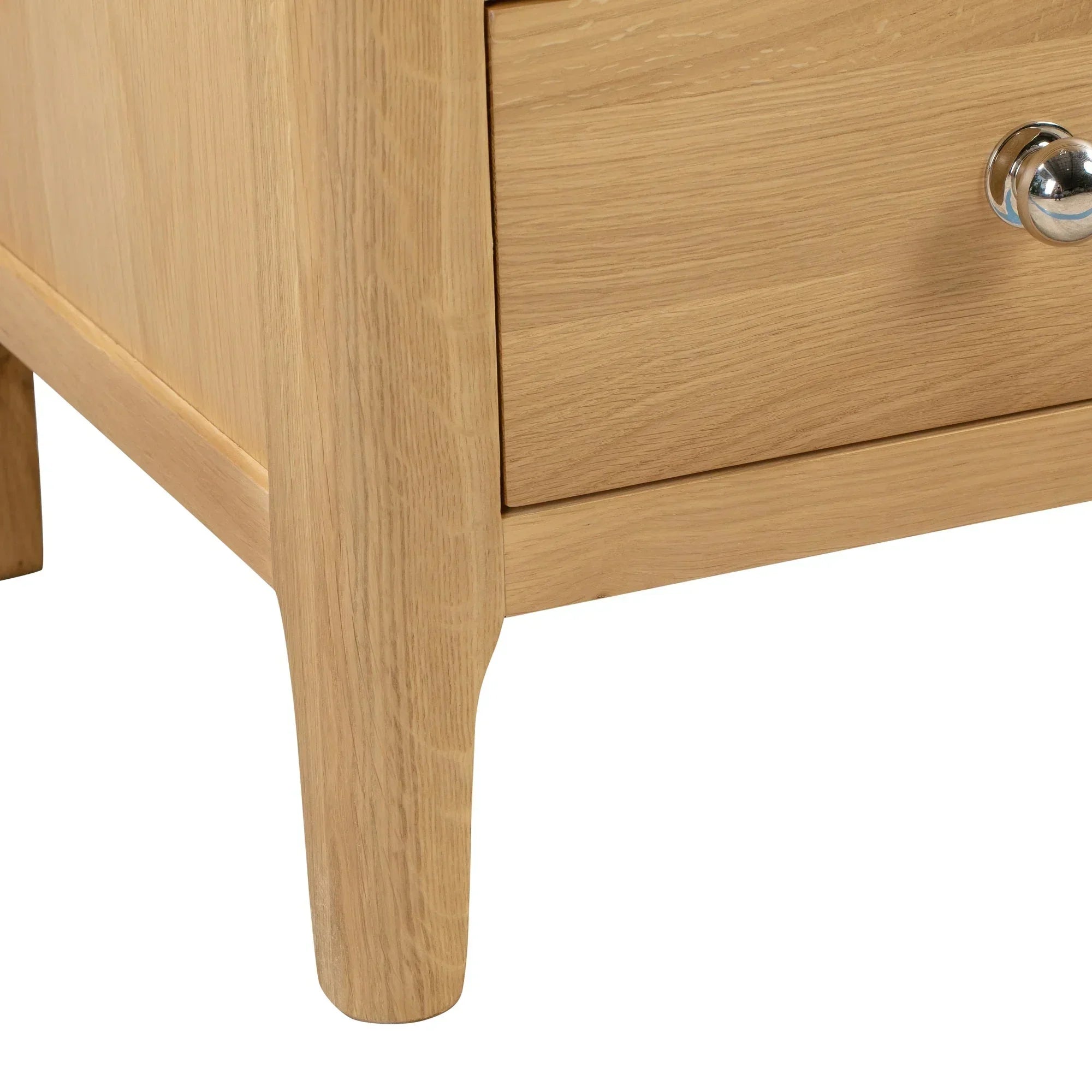 Oak 2 drawer chest corner detail showing wood grain and chrome drawer handle