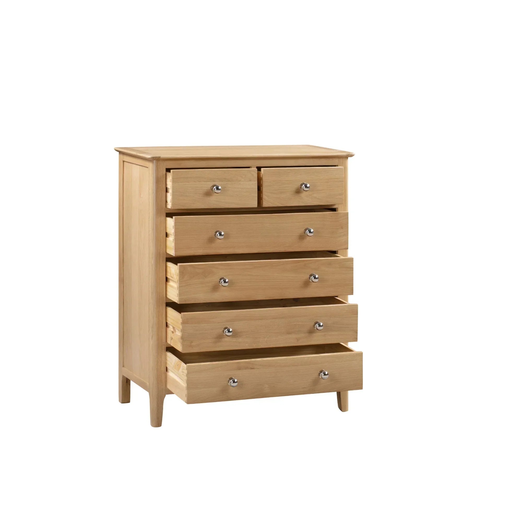 Oak chest of drawers with four large and two small drawers, all partially open