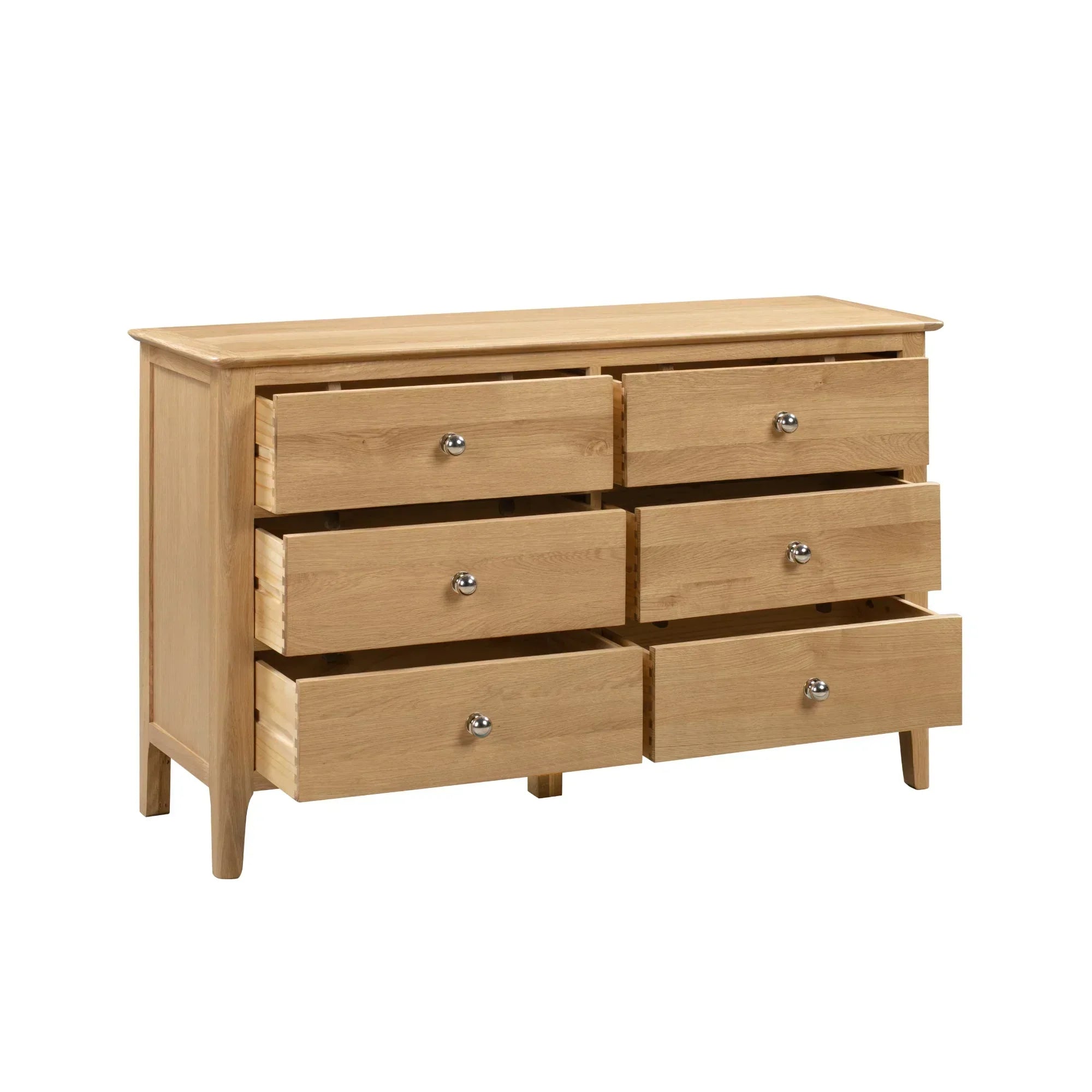 Cotswold 6 drawer wide chest in light oak finish with drawers open, angled front view