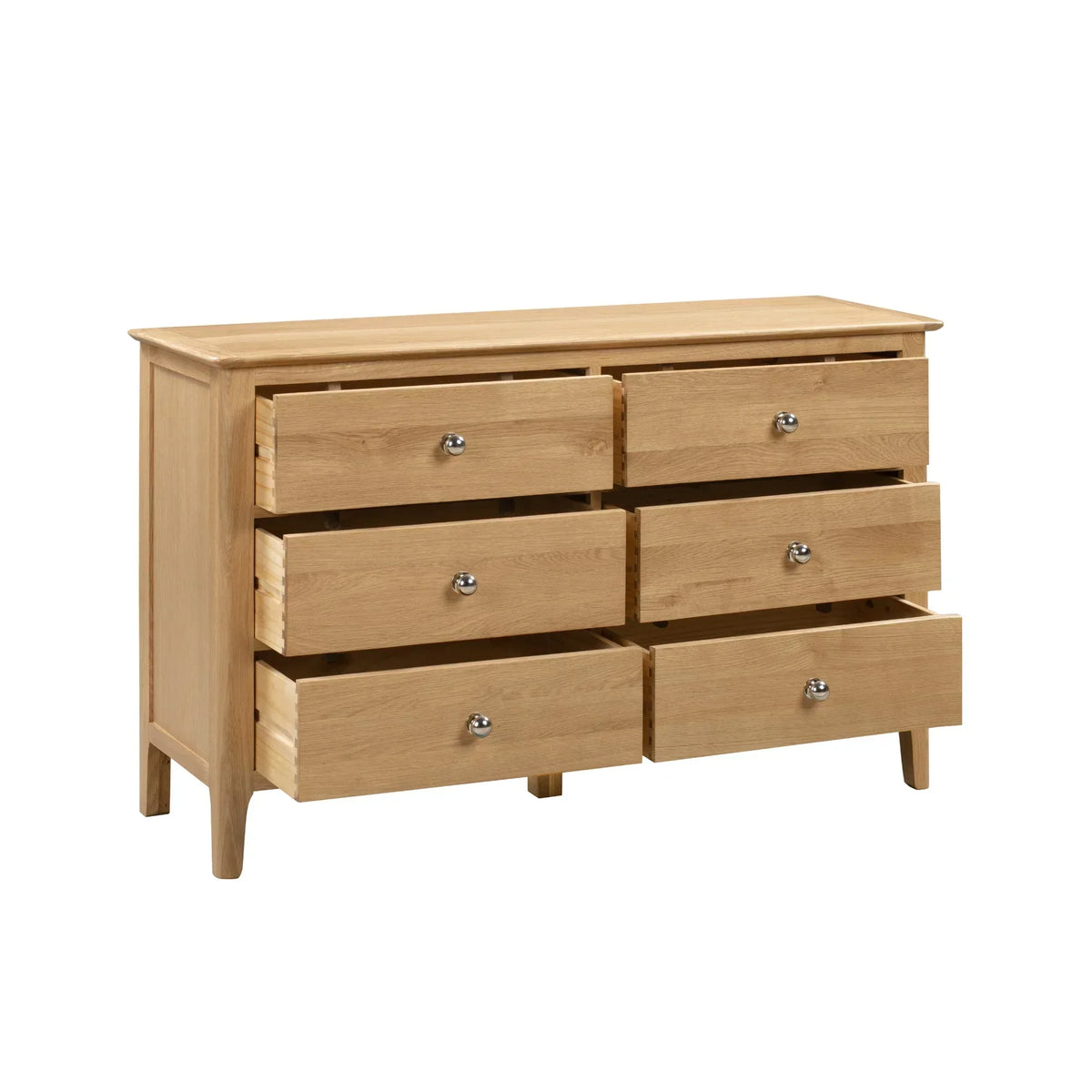 Cotswold 6 drawer wide chest in light oak finish with drawers open, angled front view