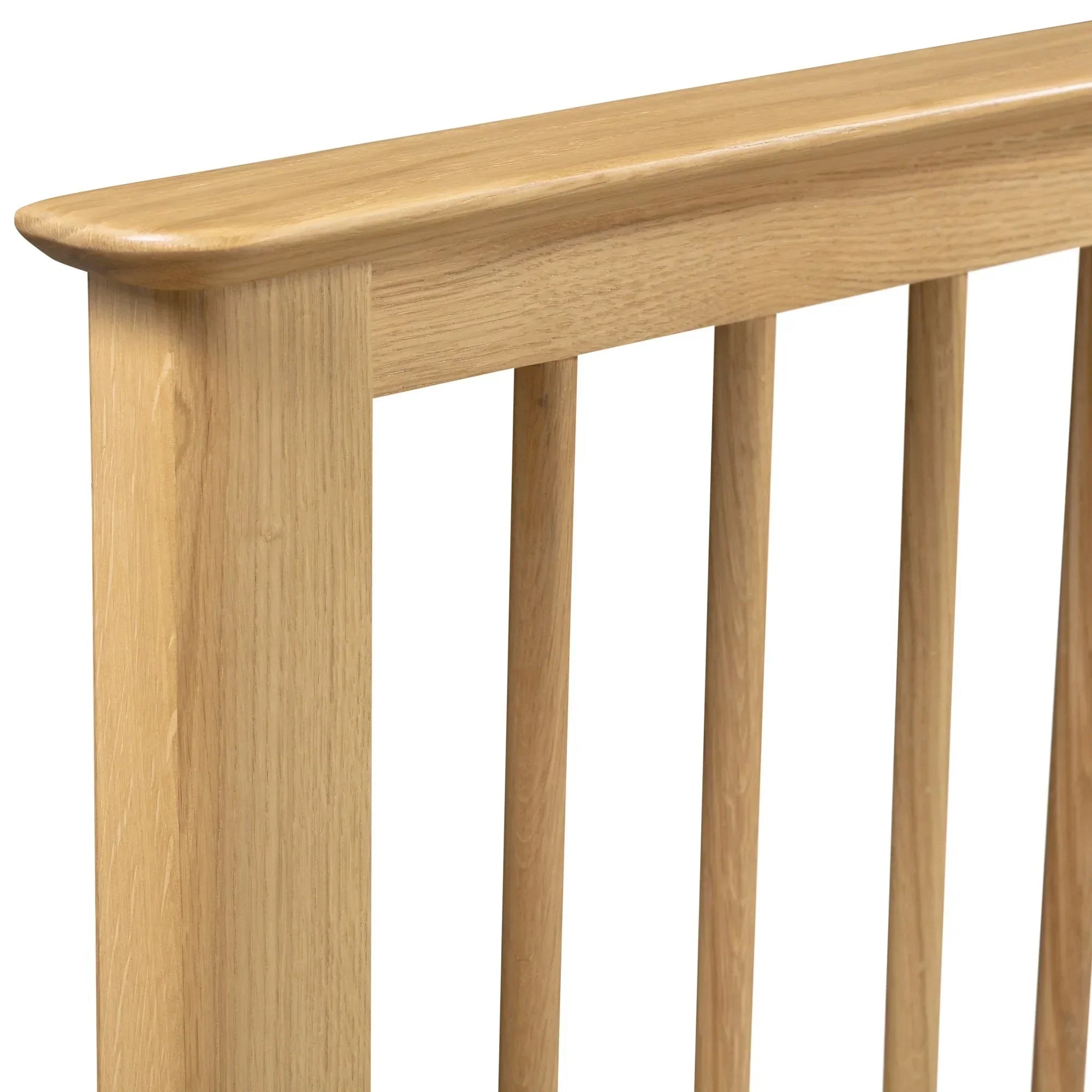 Cotswold oak double bed frame closeup showing light wood slatted headboard design