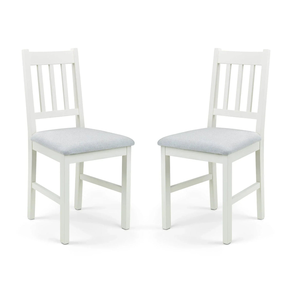 Ivory dining chair pair with cushioned seats and slatted backs on white background