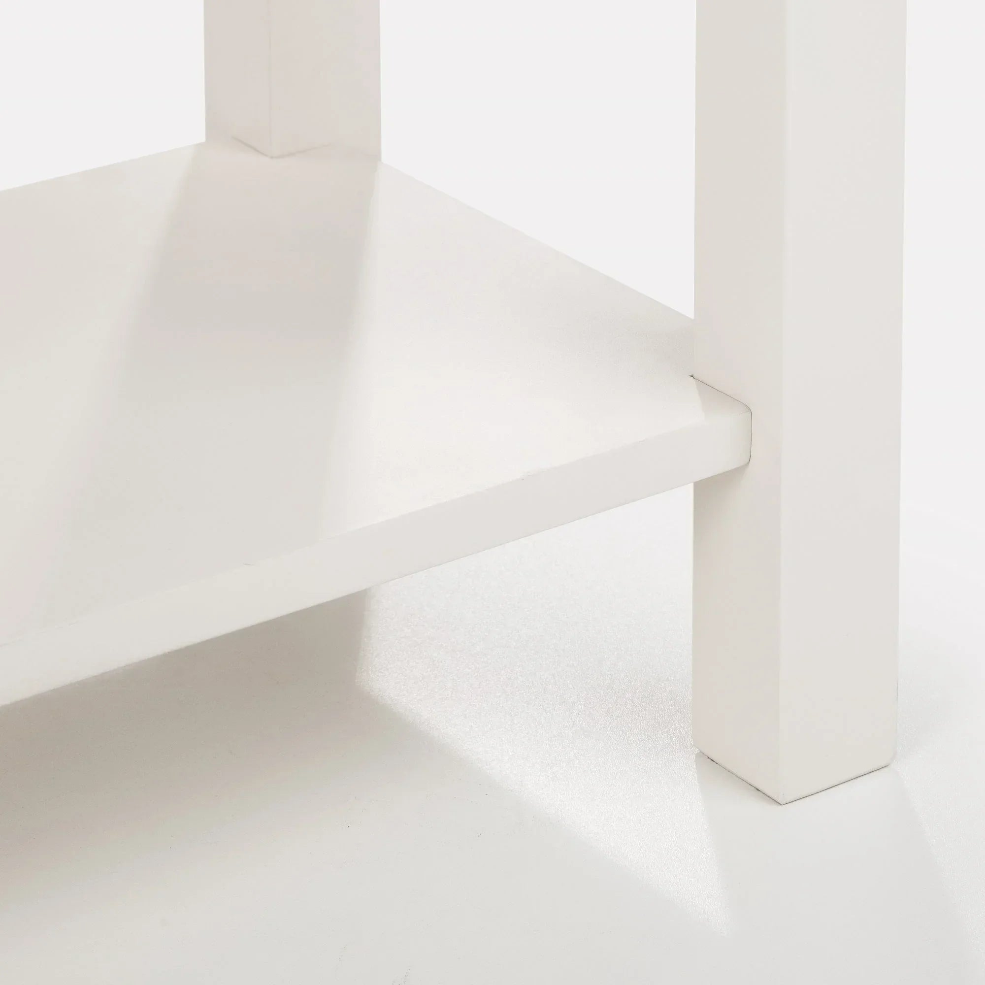 Ivory oak console table close-up showing lower shelf and leg detail