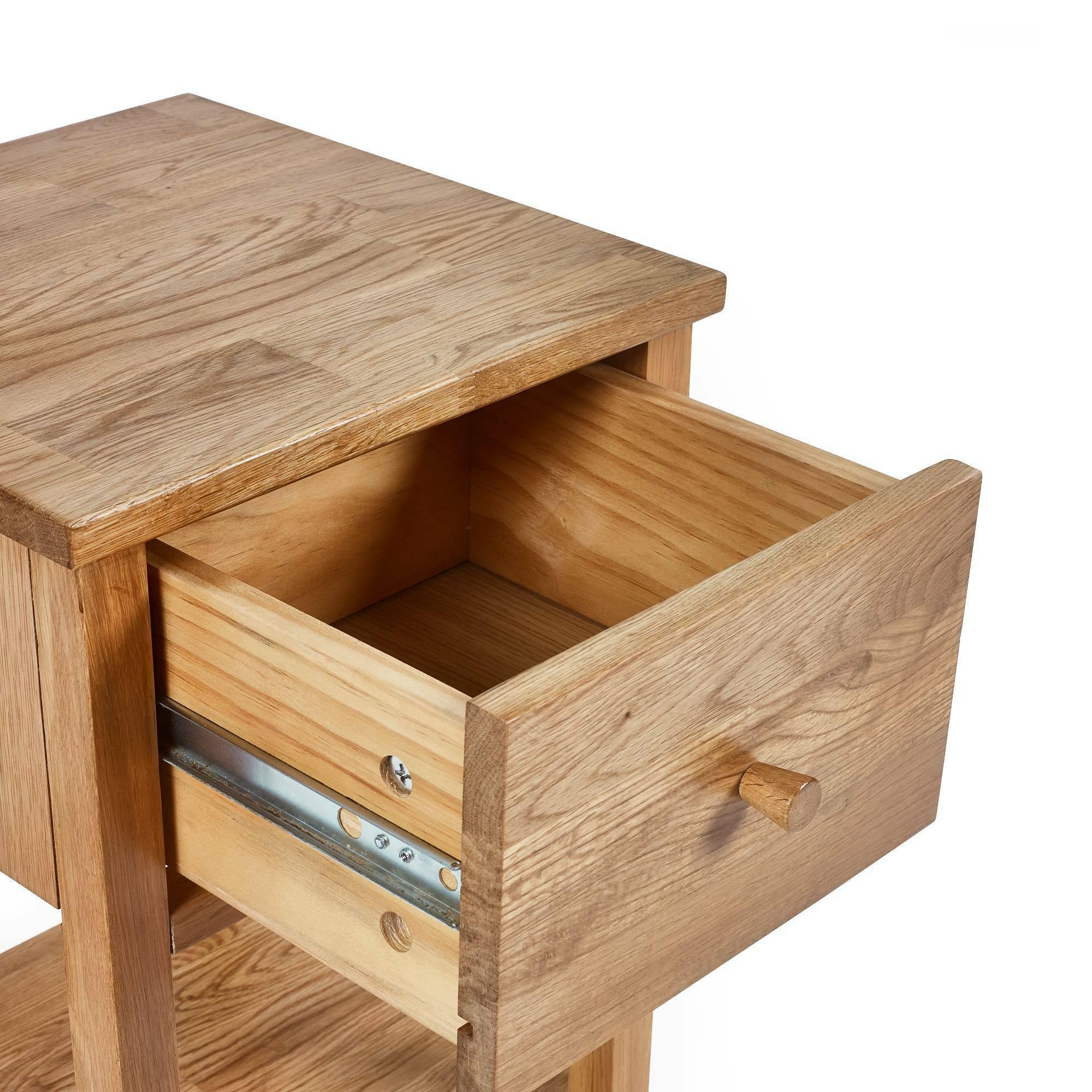 Oak bedside table with open drawer and natural wood grain finish