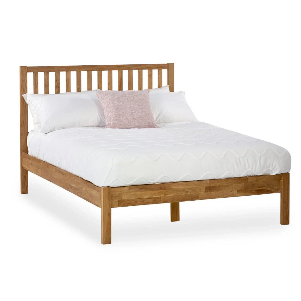 Oak double bed frame with slatted headboard and white bedding, front angle view