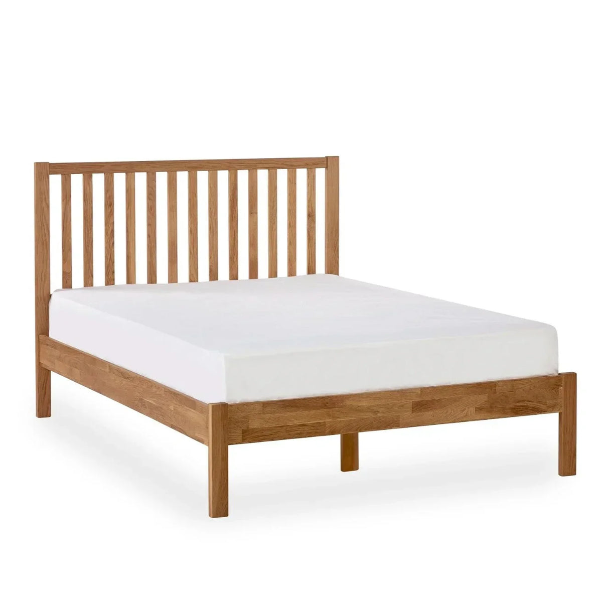 Oak double bed frame with slatted headboard and white mattress, angled front view