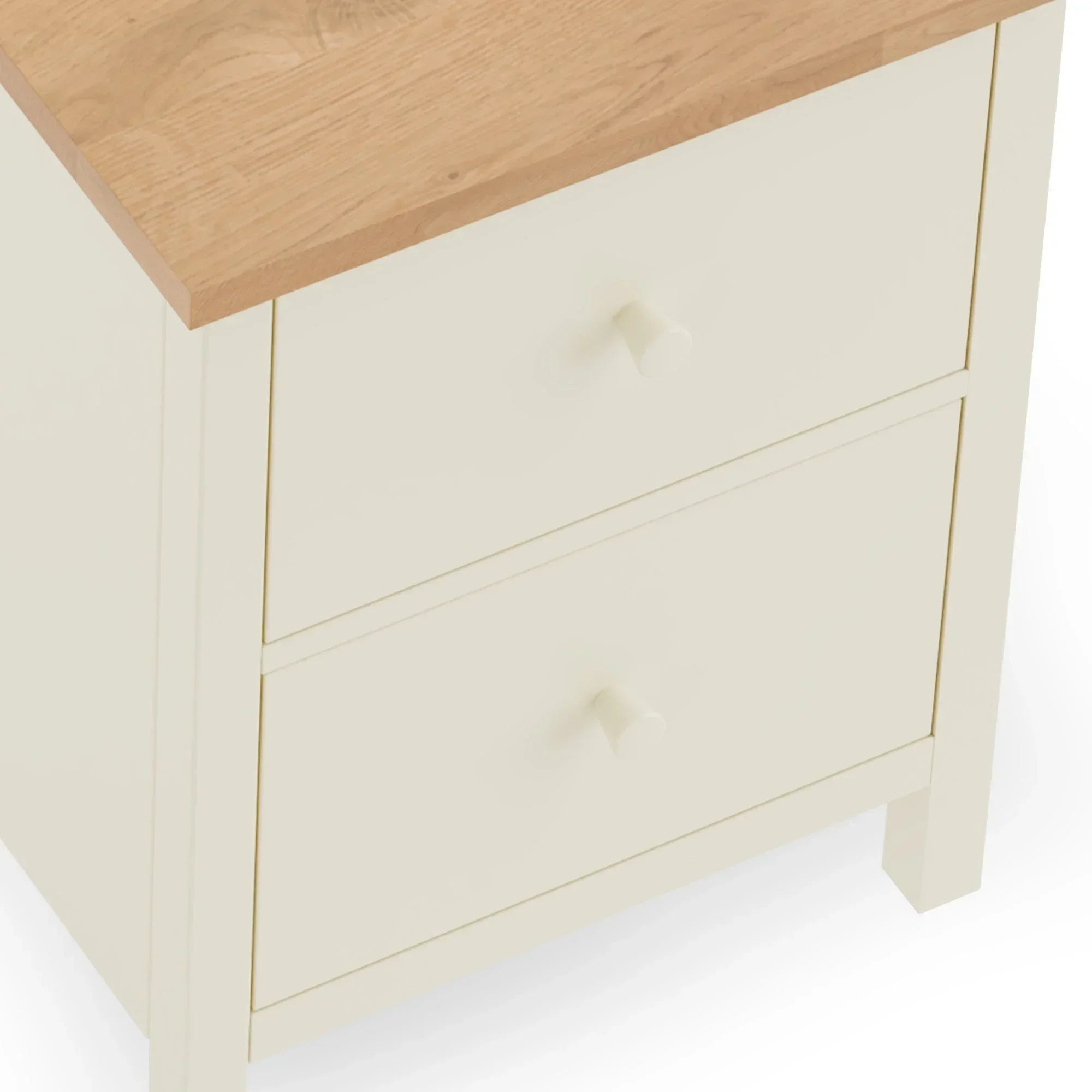 Cream bedside table with two drawers and oak effect top, angled side view
