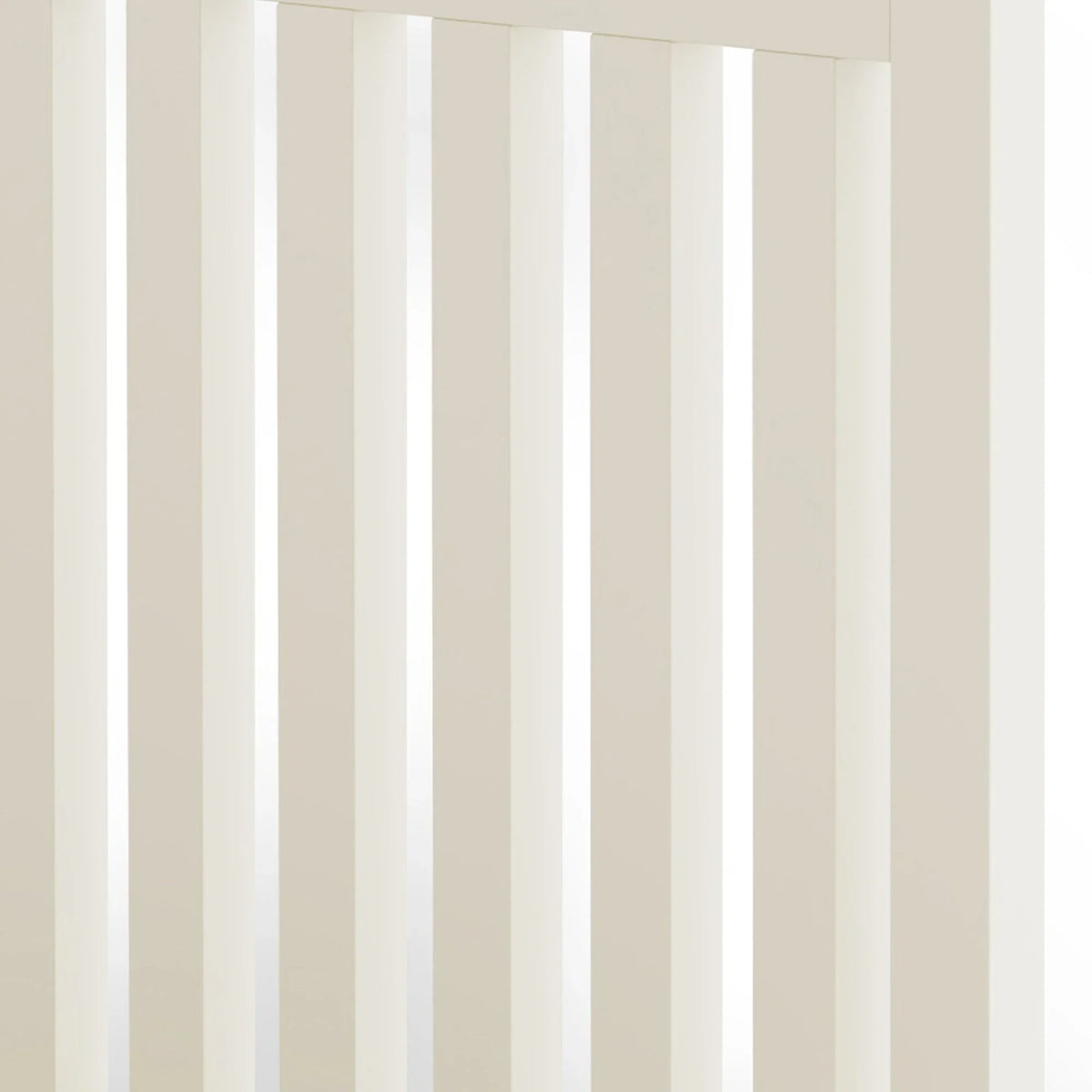 Closeup of cream wooden bed frame with vertical slats, showing smooth painted finish