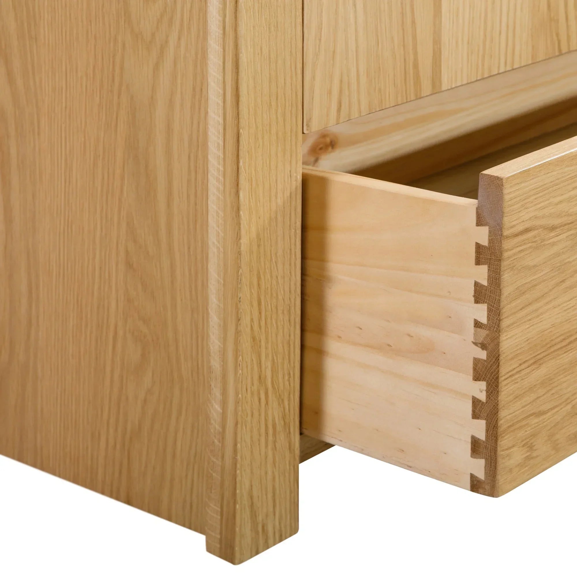 Curve 6 drawer wide chest close-up showing dovetail joint and oak wood finish