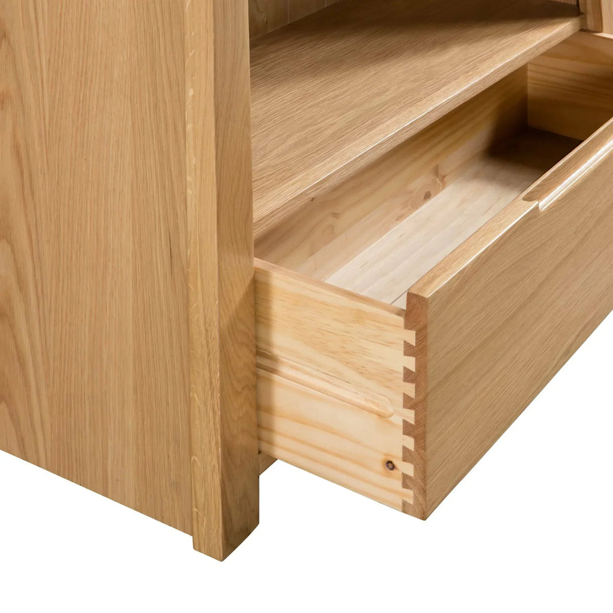 Oak TV unit with open dovetail joint drawer and visible wood grain detail