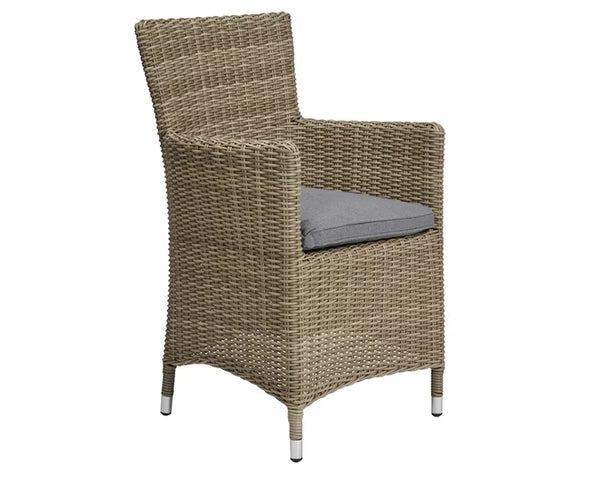 Carver chair with natural rattan weave and grey seat cushion, armrests and metal-capped legs