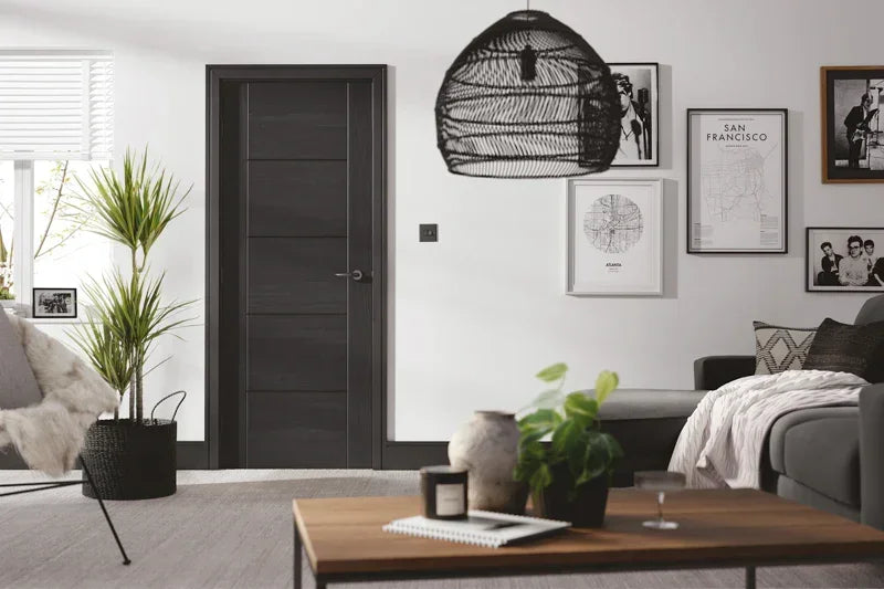 Charcoal black Vancouver 5 panel door in modern living room with sofa, coffee table and wall art