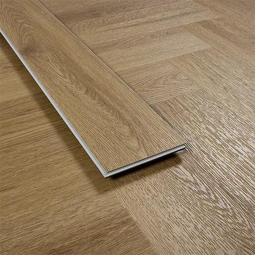 Chestnut effect vinyl plank flooring close-up showing wood grain texture and colour variation