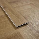 Chestnut effect vinyl plank flooring close-up showing wood grain texture and colour variation