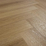 Chestnut wood effect flooring in herringbone pattern with textured grain detail
