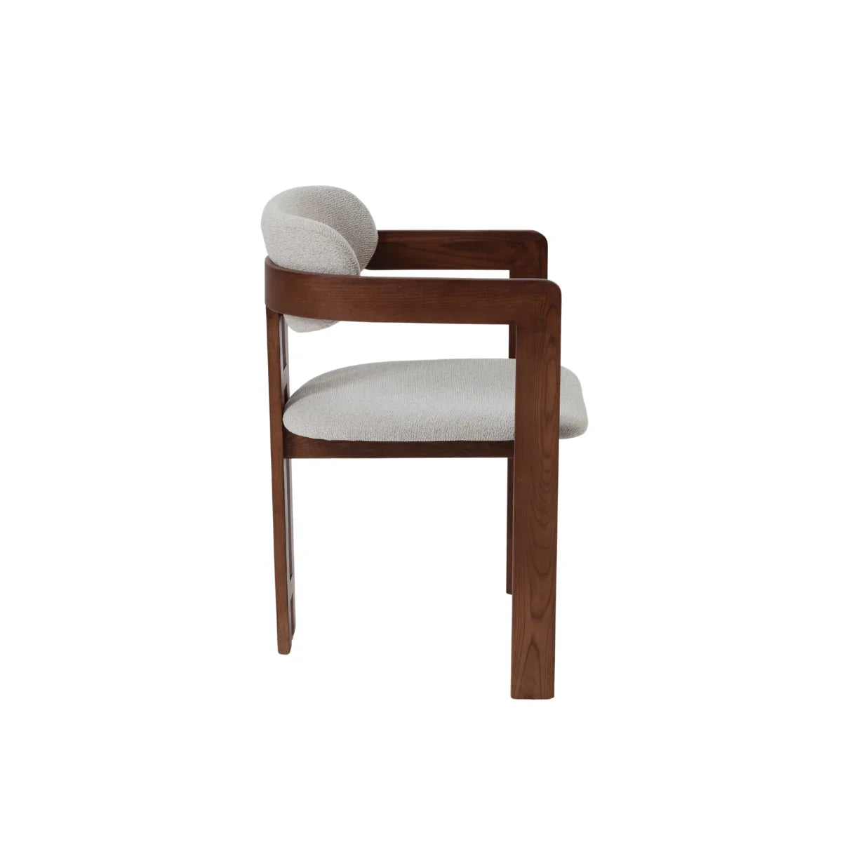Clara dining chair side view with dark wood frame and upholstered seat and backrest