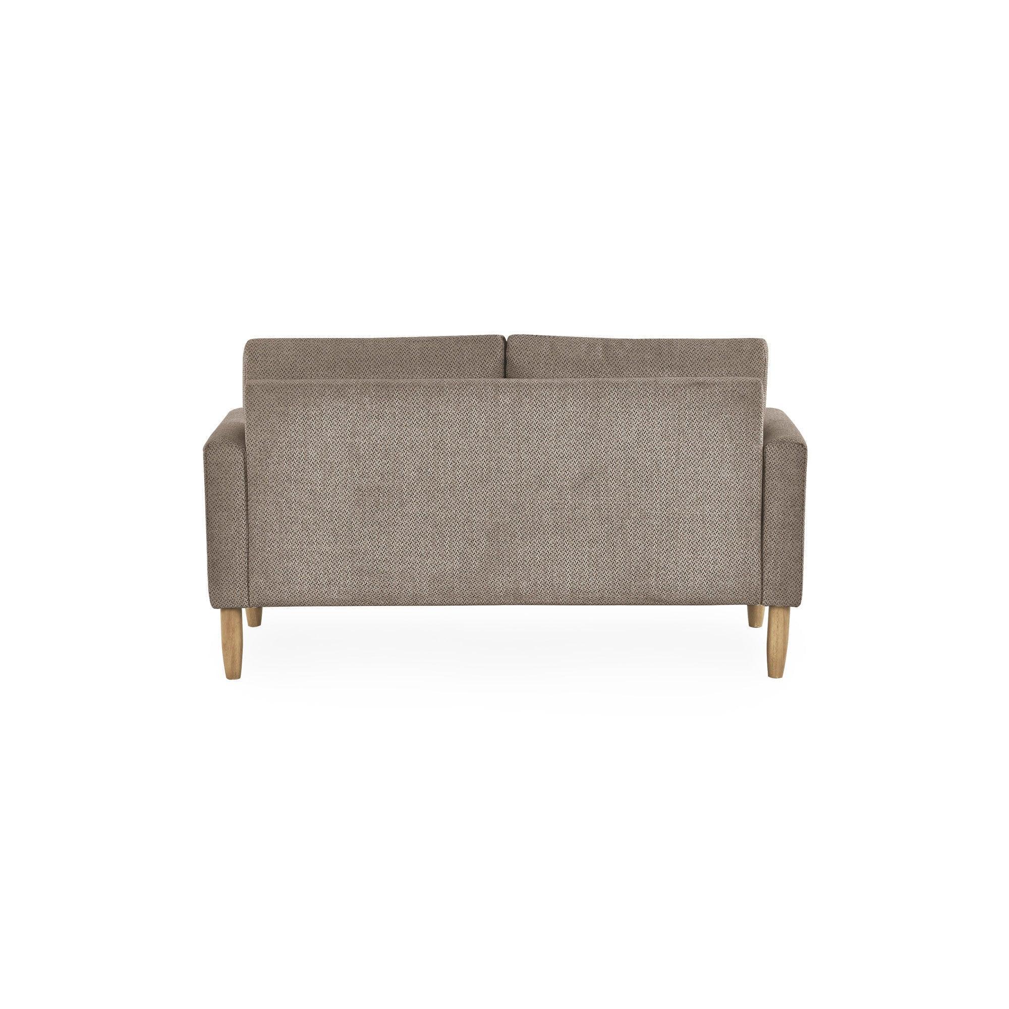 Rear view of beige fabric sofa with wooden legs on white background
