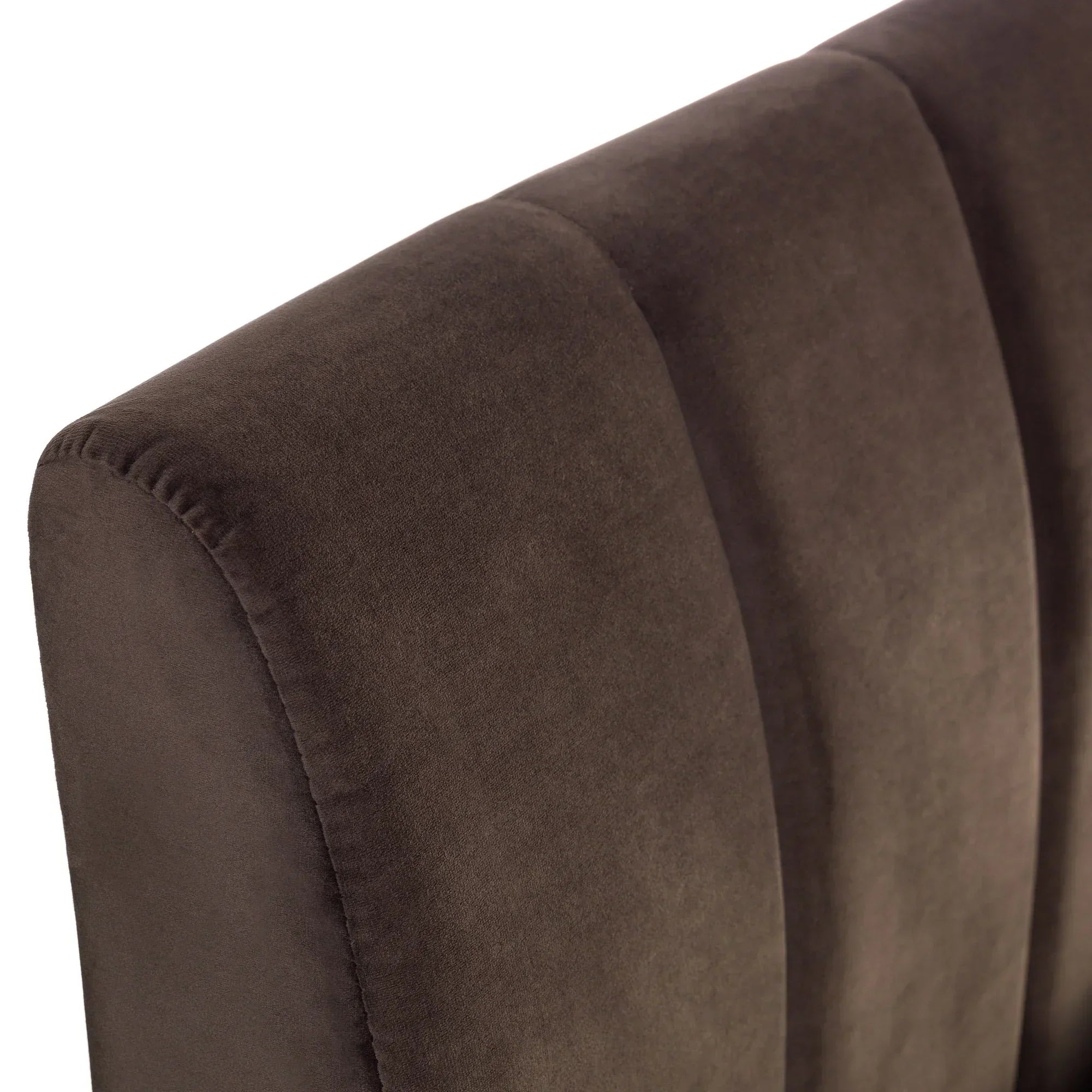 Truffle velvet king bed headboard with panel stitching, close-up of plush upholstery