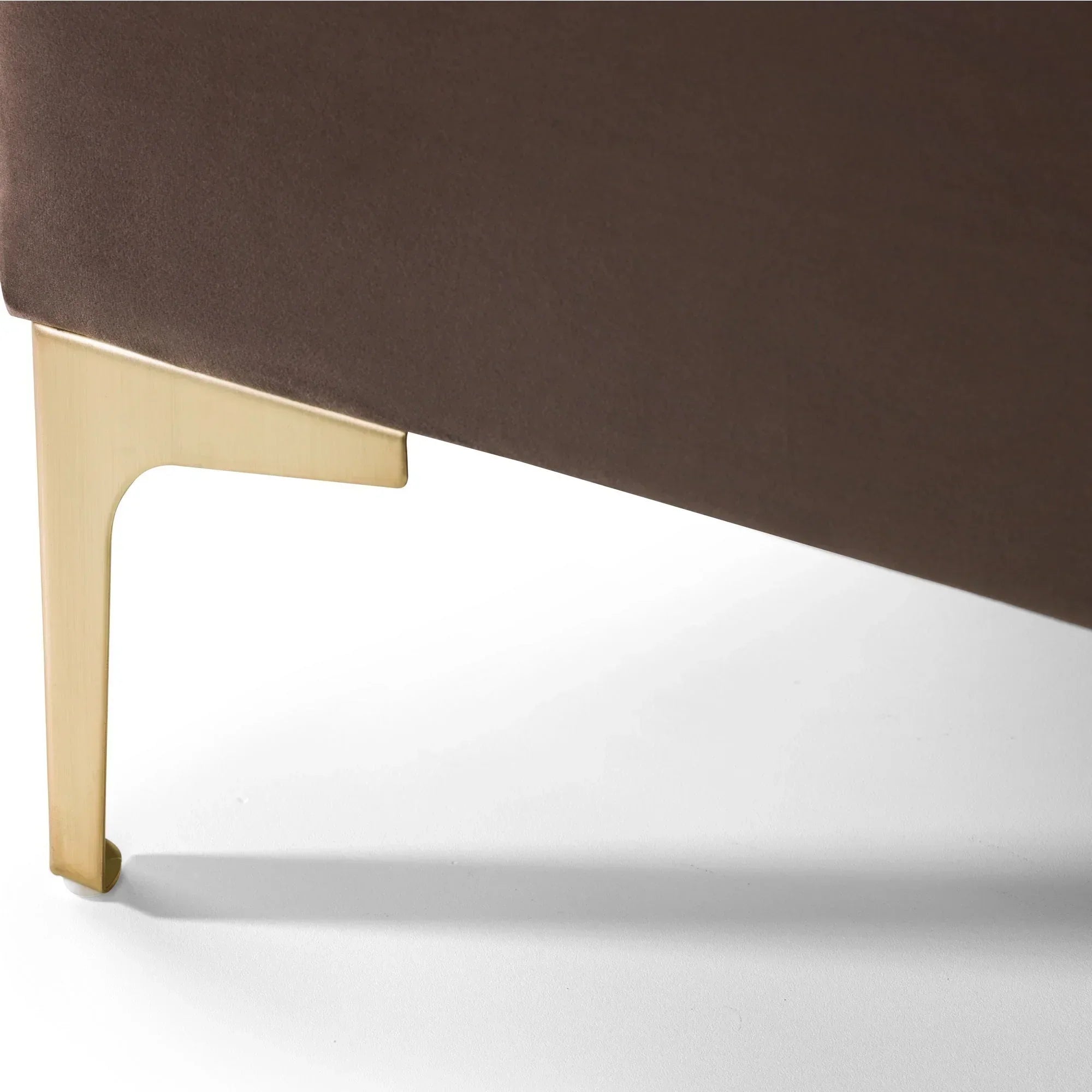 Velvet king bed in truffle with gold metal leg detail on white background