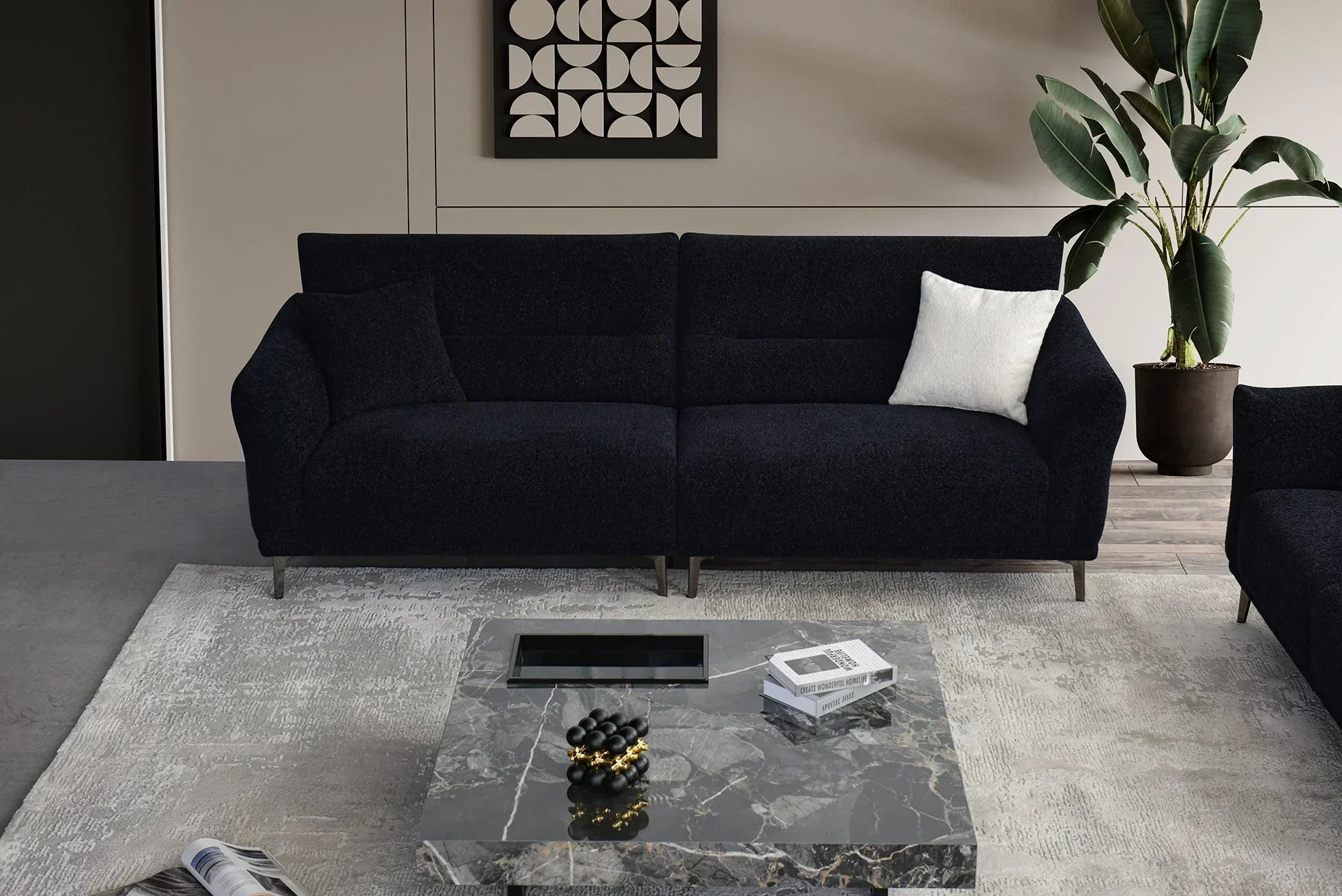 Dark fabric sofa with white cushion, marble coffee table and indoor plant in modern living room