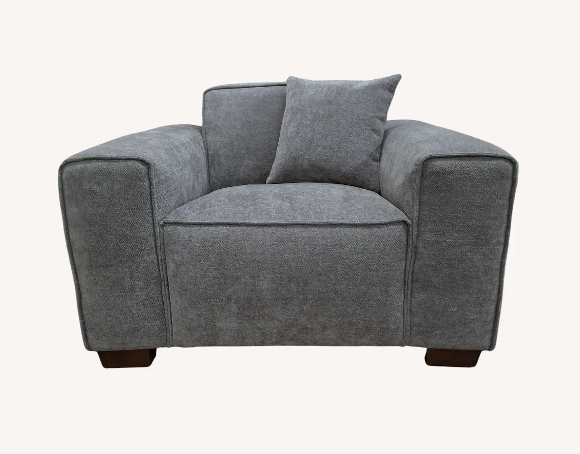 Charcoal fabric armchair with wide arms and cushion, front view on white background