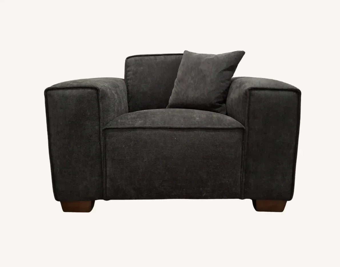 Midnight chair with charcoal fabric, wide armrests, single back cushion, and dark wood feet