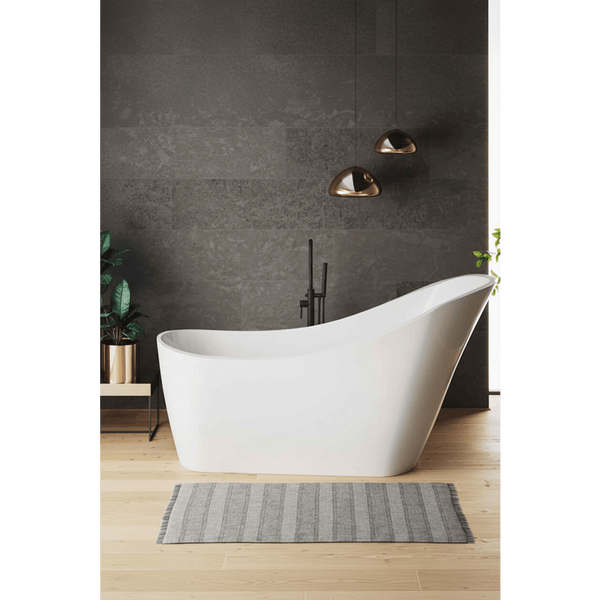 Modern bathroom with a freestanding white bathtub against a dark gray wall.