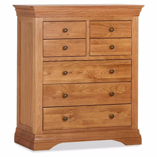 Oak 7 drawer chest with brass knobs and paneled sides, classic bedroom storage furniture