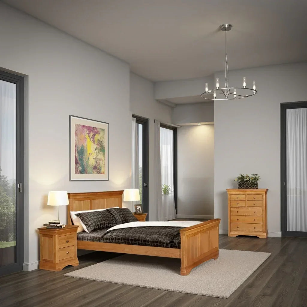 Oak bed frame with matching bedside tables and chest of drawers in modern bedroom