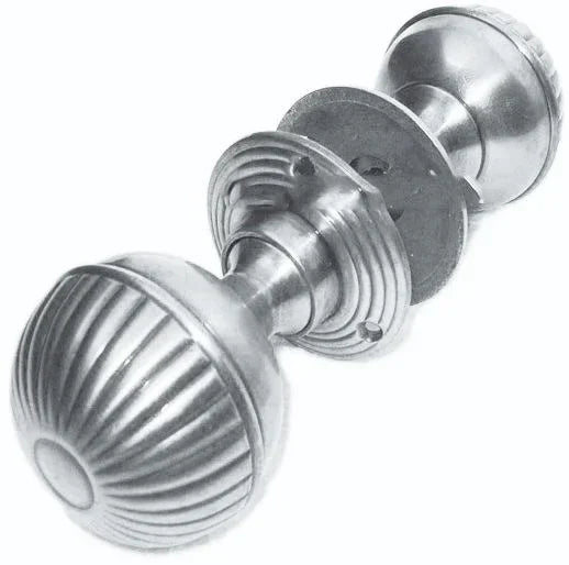 Brushed metal door knob with fluted round design, shown at an angle