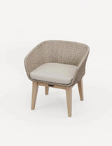 Beige woven accent chair with curved back and light wood legs, upholstered seat cushion
