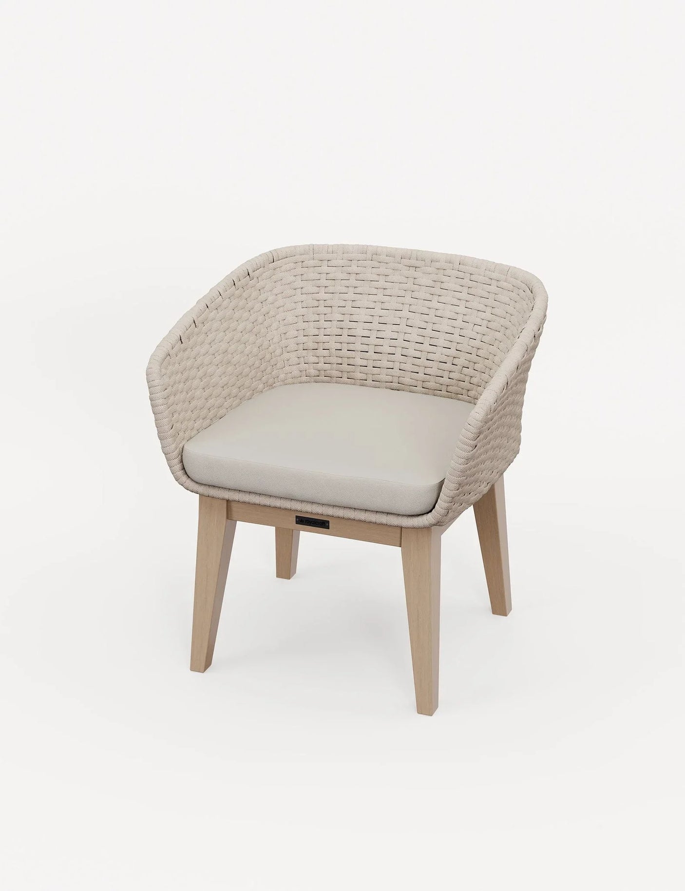 Beige rattan accent chair with light wood legs and cushioned seat on white background