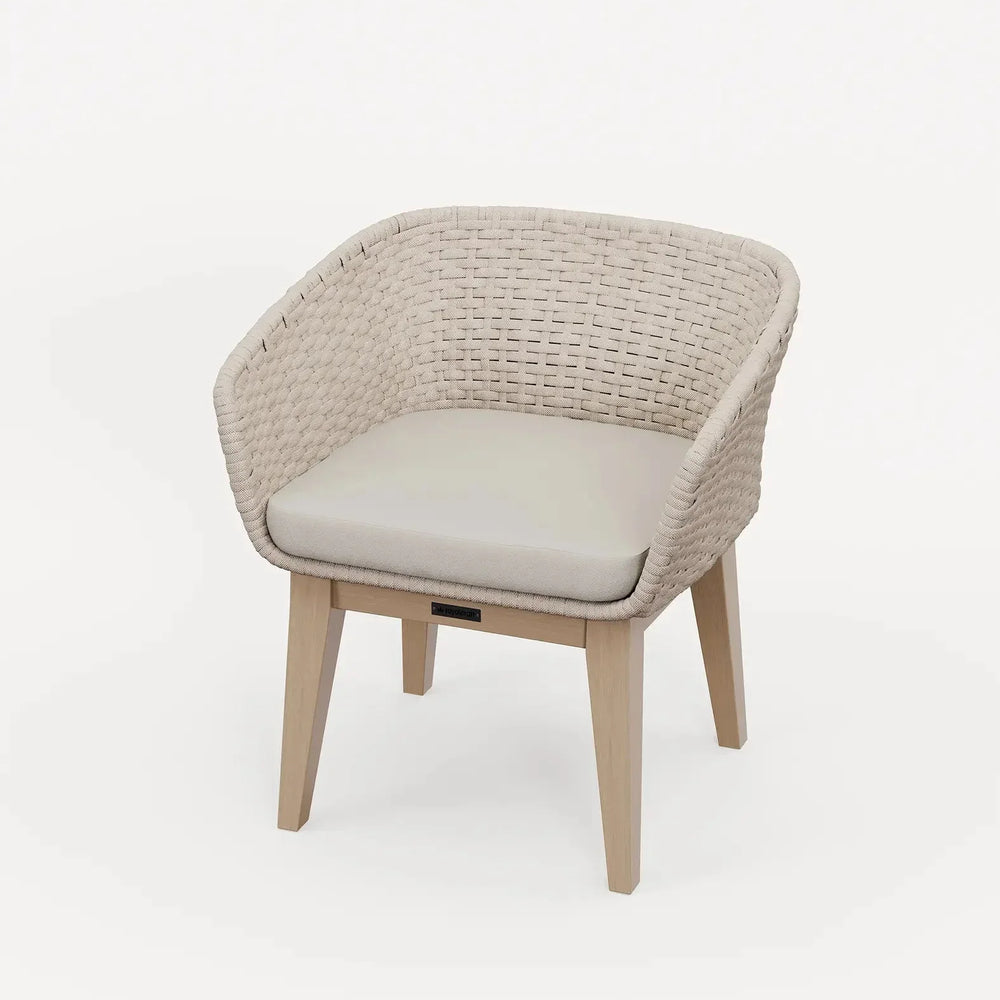 Beige woven accent chair with light wooden legs and cushioned seat on white background