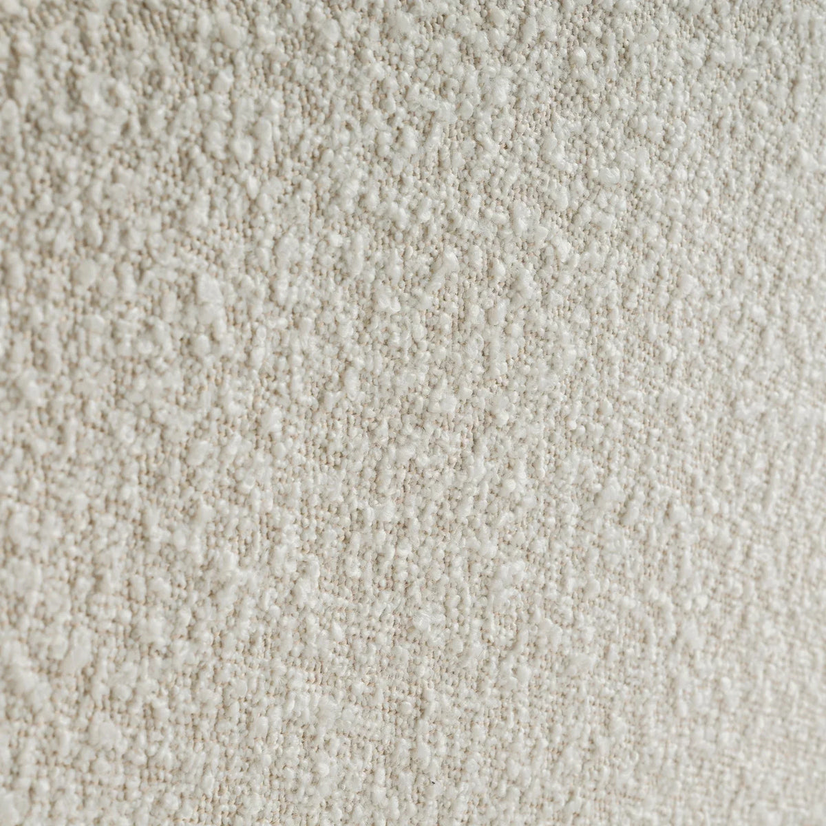Ivory boucle fabric texture close-up on double bed upholstery