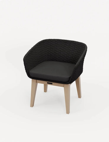 Black woven armchair with cushioned seat and light wood legs on white background