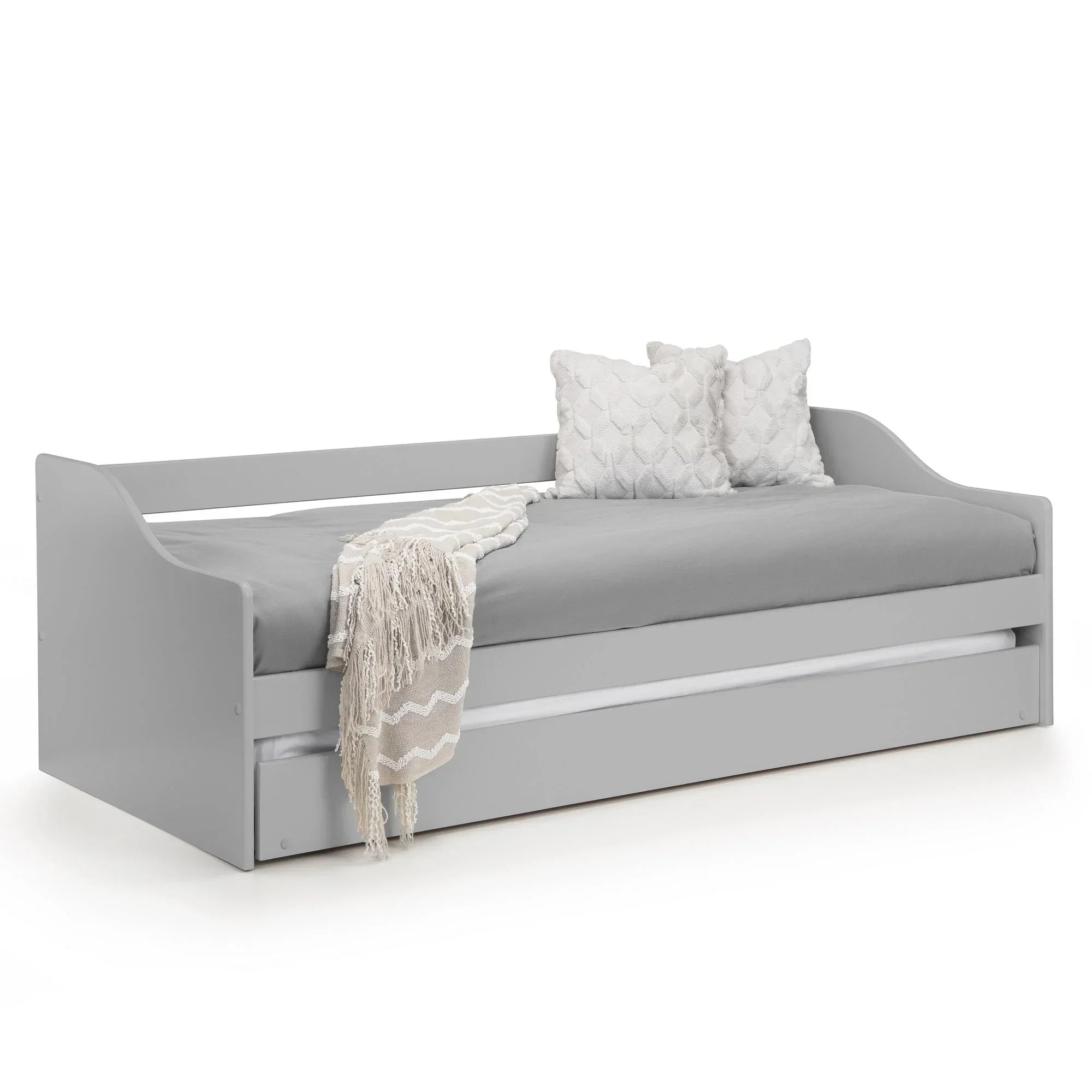 Dove grey single daybed with trundle, blanket, and two textured cushions on white background