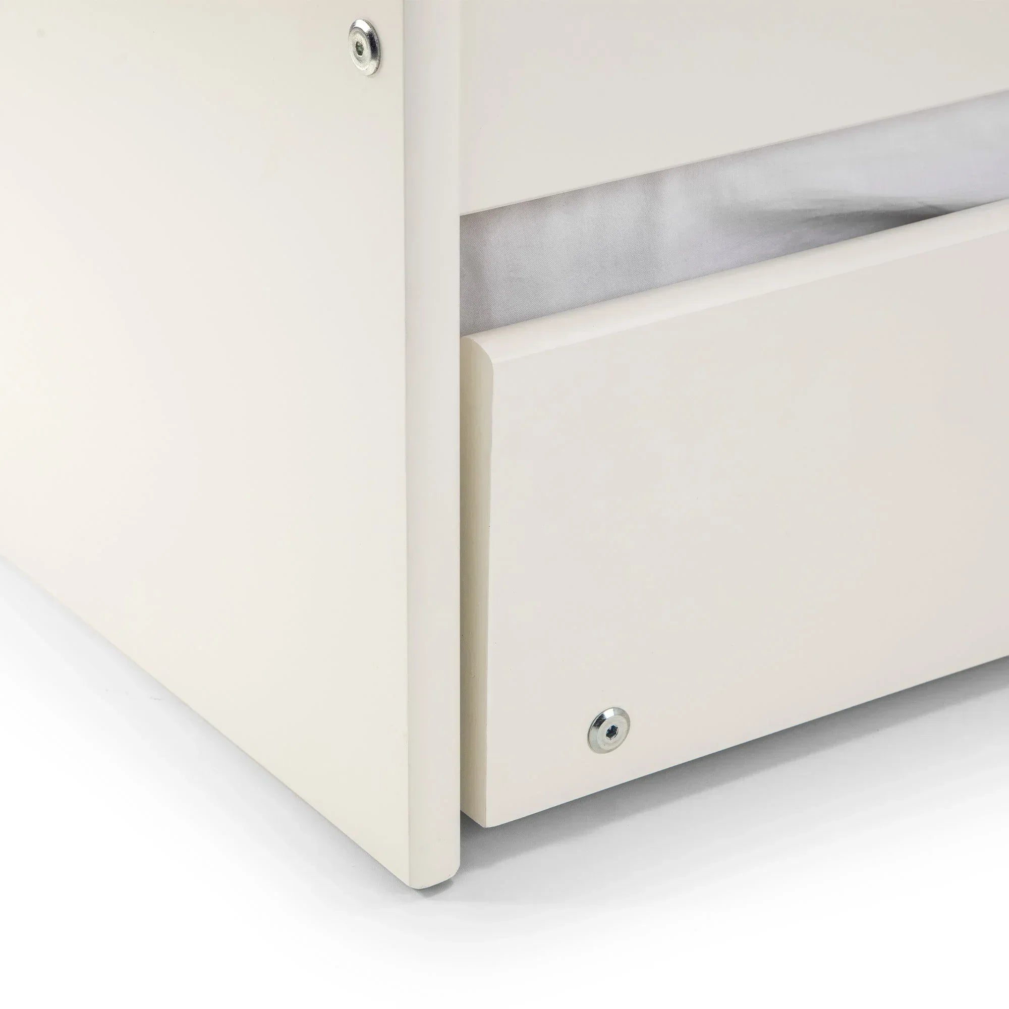 Surf white single daybed base with close-up view of storage drawer and corner detail