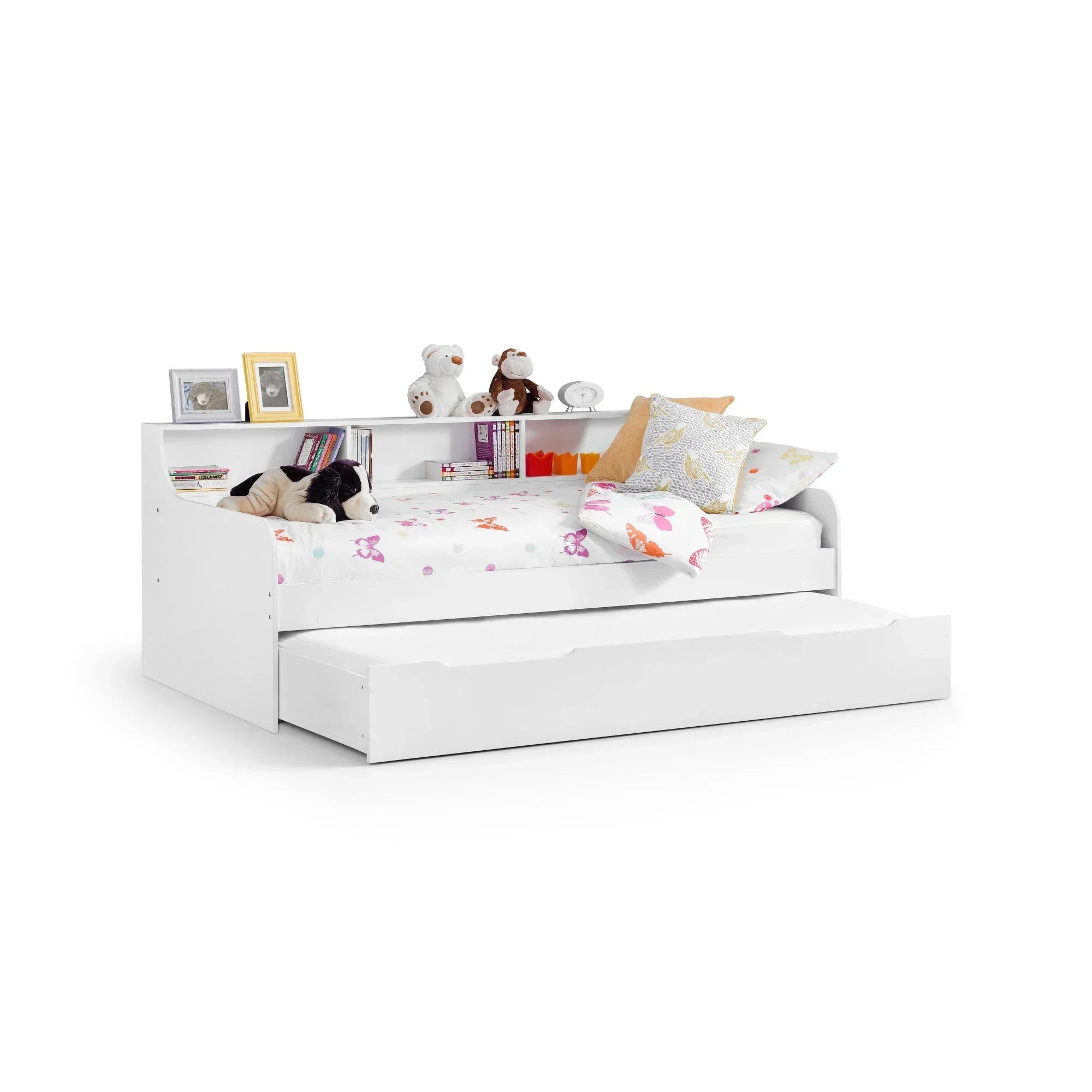 White trundle storage bed with shelving, kids’ bedding, books, toys, and pull-out drawer