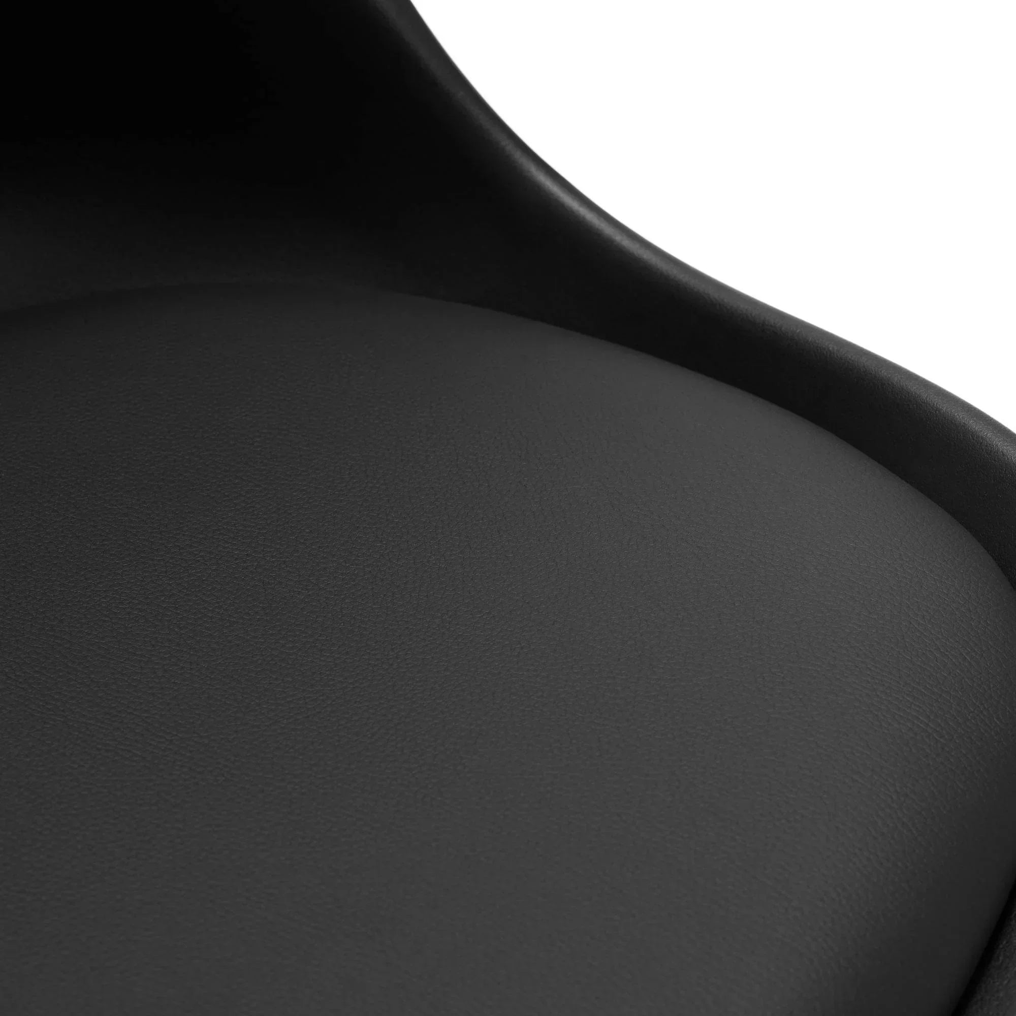 Closeup of black office chair seat with curved backrest and smooth upholstery texture