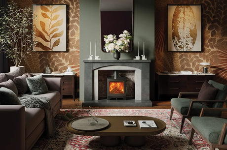 A stylish living room featuring an Echo wood burning stove, surrounded by elegant decor and furnishings.