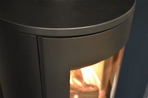 Mourne Eco 980 stove installed with wood burning and clear glass flame view