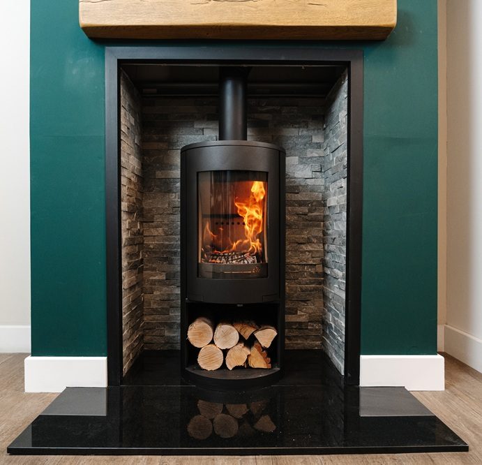 Side view of Mourne Eco 980 stove highlighting steel body and flue outlet
