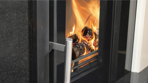 Side view of Mourne Eco Inset 400 stove showing steel body and cast iron door
