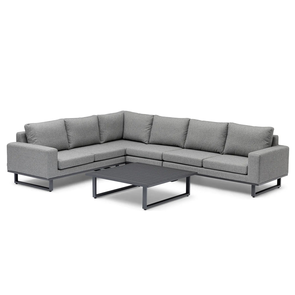 Grey corner group fabric sofa with metal legs and low rectangular coffee table
