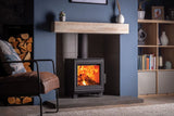 Eton wood burning stove with a warm fire, set against a stylish living room backdrop.
