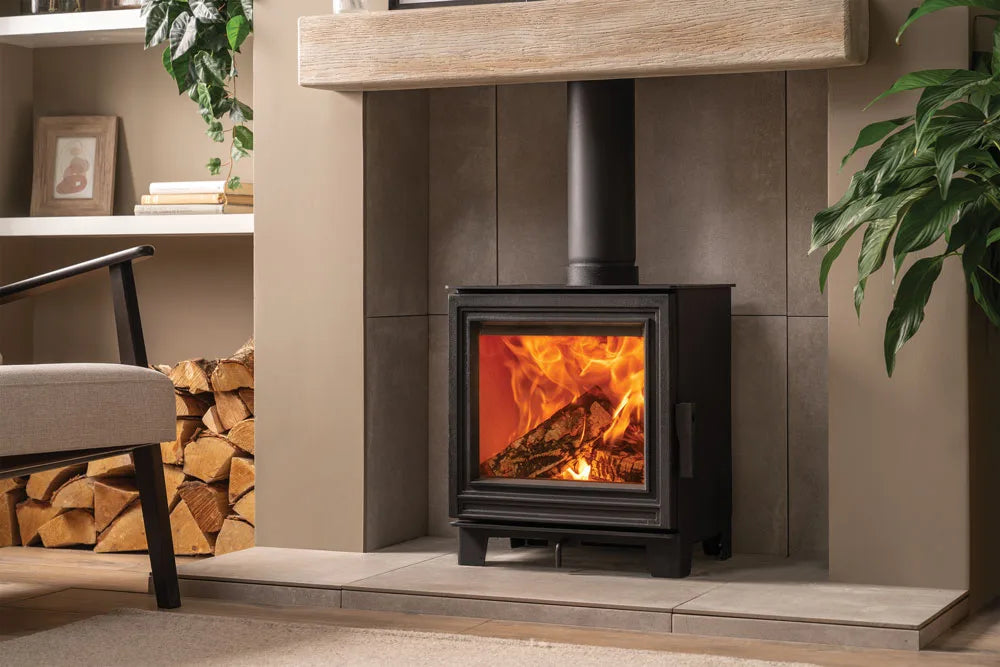 Eton wood burning stove with a roaring fire, set in a stylish living room.