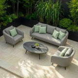Grey outdoor sofa set with armchairs, light green cushions, and oval table on patio tiles