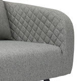 Grey fabric sofa with diamond quilted backrest and textured seat close-up